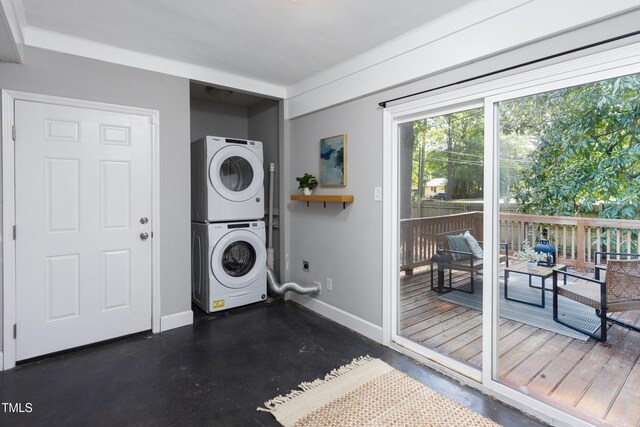 2801 E Shoreham St, Durham, NC 27707 - laundry area featuring stacked washer / drying machine and baseboards