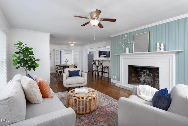 2801 E Shoreham St, Durham, NC 27707 - living area featuring ornamental molding, wood finished floors, ceiling fan, and a brick fireplace