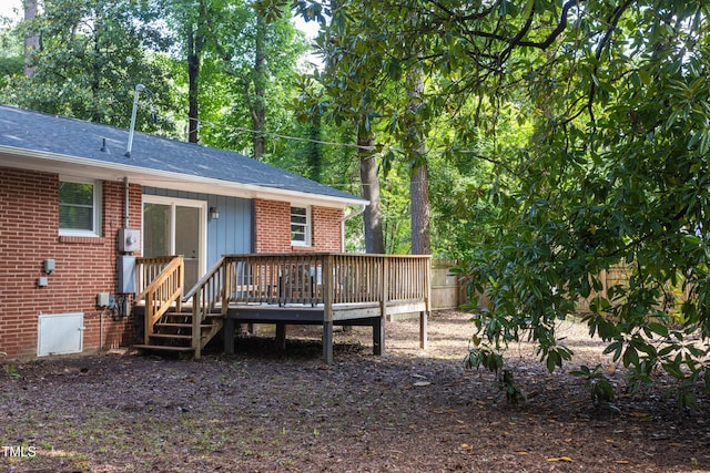 2801 E Shoreham St, Durham, NC 27707 - back of property featuring brick siding, a deck, and roof with shingles