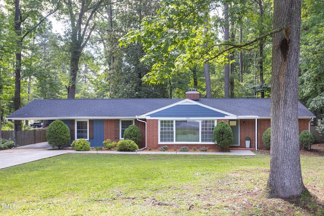 2801 E Shoreham St, Durham, NC 27707 - ranch-style house featuring brick siding, concrete driveway, a chimney, an attached carport, and a shingled roof