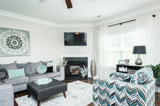 514 Alamanni Ct, Graham, NC 27253 - living area with crown molding, dark wood-style flooring, a ceiling fan, and a fireplace