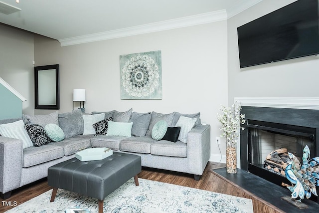 514 Alamanni Ct, Graham, NC 27253 - living area with wood finished floors, crown molding, and a fireplace with raised hearth