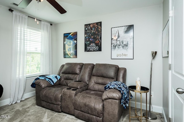 514 Alamanni Ct, Graham, NC 27253 - carpeted living area with baseboards and ceiling fan