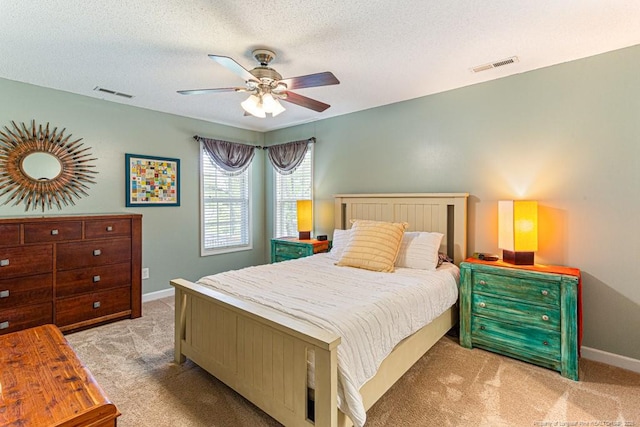 2 Beryl Cir, Pinehurst, NC 28374 - bedroom with light colored carpet, a textured ceiling, and a ceiling fan