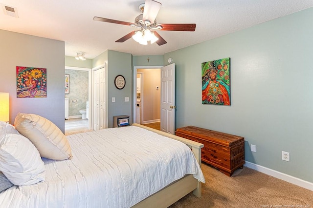 2 Beryl Cir, Pinehurst, NC 28374 - carpeted bedroom featuring ensuite bath, a ceiling fan, and a closet