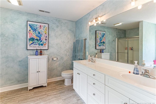 2 Beryl Cir, Pinehurst, NC 28374 - bathroom with a stall shower, double vanity, and wood finished floors