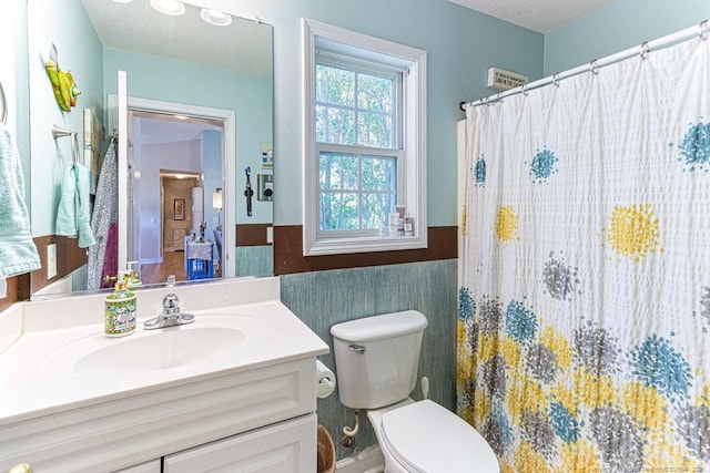 2 Beryl Cir, Pinehurst, NC 28374 - full bathroom featuring vanity, wainscoting, and a shower with curtain