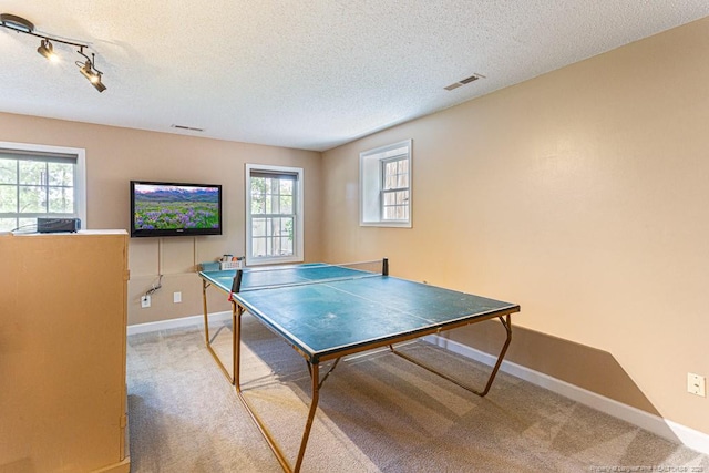 2 Beryl Cir, Pinehurst, NC 28374 - game room featuring carpet floors, a textured ceiling, and rail lighting