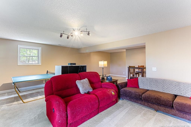 2 Beryl Cir, Pinehurst, NC 28374 - carpeted living room featuring rail lighting and a textured ceiling