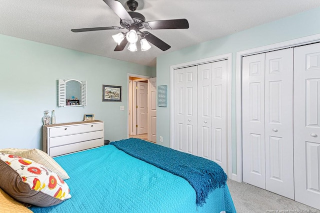 2 Beryl Cir, Pinehurst, NC 28374 - bedroom with carpet, multiple closets, a ceiling fan, and a textured ceiling