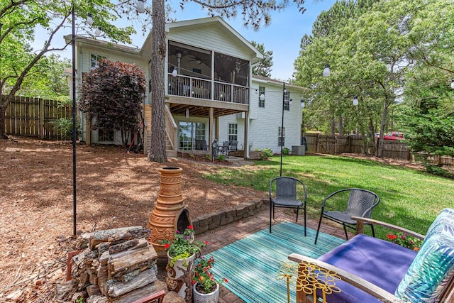2 Beryl Cir, Pinehurst, NC 28374 - rear view of property with a ceiling fan, a sunroom, a fenced backyard, and stairway
