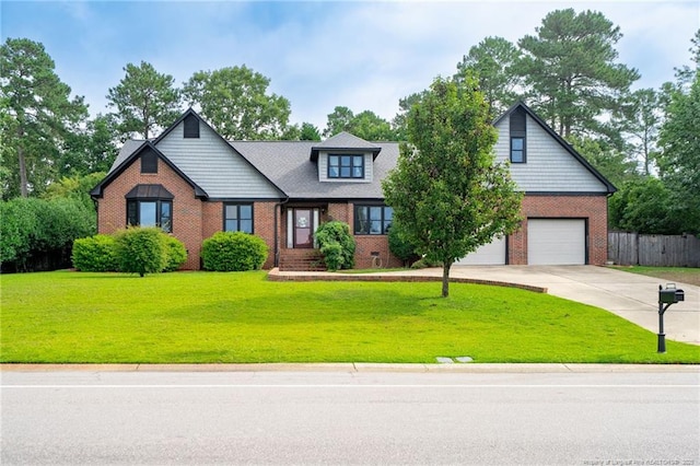 4304 Ferncreek Dr, Fayetteville, NC 28314 - view of front of home with an attached garage, brick siding, and driveway