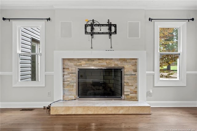 4304 Ferncreek Dr, Fayetteville, NC 28314 - detailed view of wood finished floors, crown molding, and a tiled fireplace
