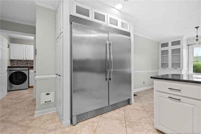 4304 Ferncreek Dr, Fayetteville, NC 28314 - kitchen with built in refrigerator, washer / clothes dryer, ornamental molding, white cabinets, and backsplash