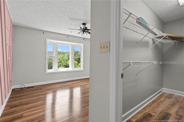 4304 Ferncreek Dr, Fayetteville, NC 28314 - walk in closet with wood finished floors and a ceiling fan