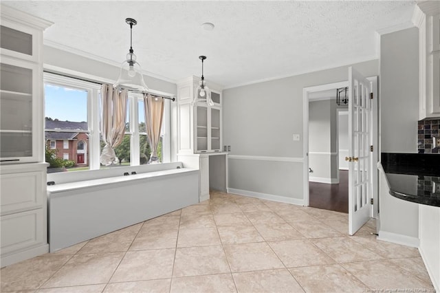 4304 Ferncreek Dr, Fayetteville, NC 28314 - bathroom featuring a textured ceiling, decorative backsplash, ornamental molding, and tile patterned flooring