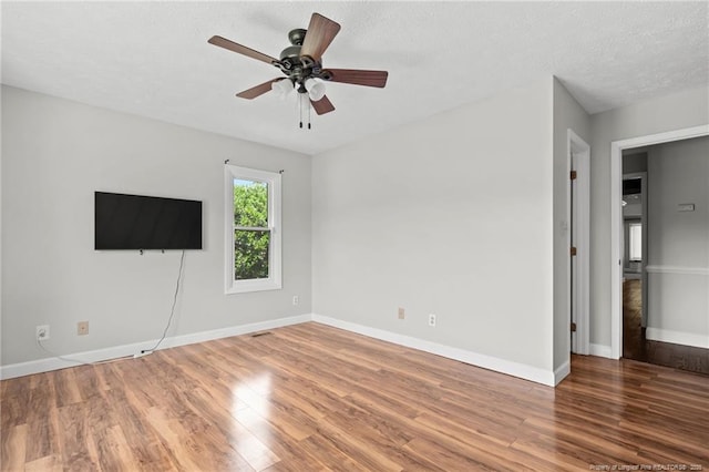 4304 Ferncreek Dr, Fayetteville, NC 28314 - spare room with wood finished floors, a ceiling fan, and a textured ceiling