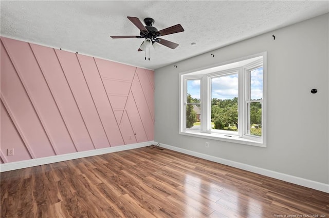 4304 Ferncreek Dr, Fayetteville, NC 28314 - empty room featuring wood finished floors, a textured ceiling, and ceiling fan