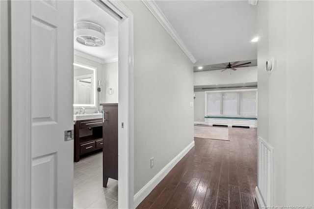 4304 Ferncreek Dr, Fayetteville, NC 28314 - corridor featuring crown molding, wood-type flooring, a baseboard radiator, and recessed lighting