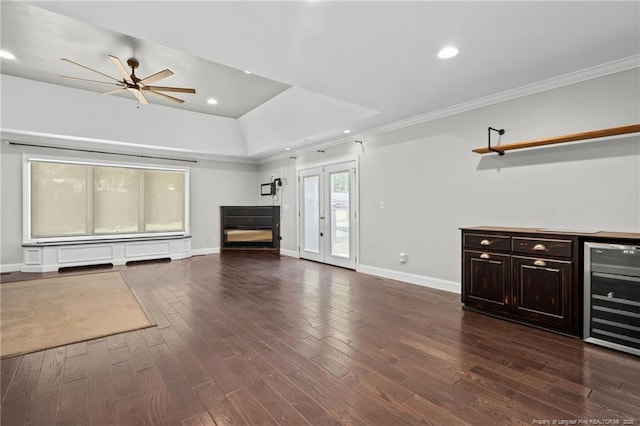 4304 Ferncreek Dr, Fayetteville, NC 28314 - unfurnished living room featuring wine cooler, ceiling fan, dark wood-style flooring, crown molding, and recessed lighting