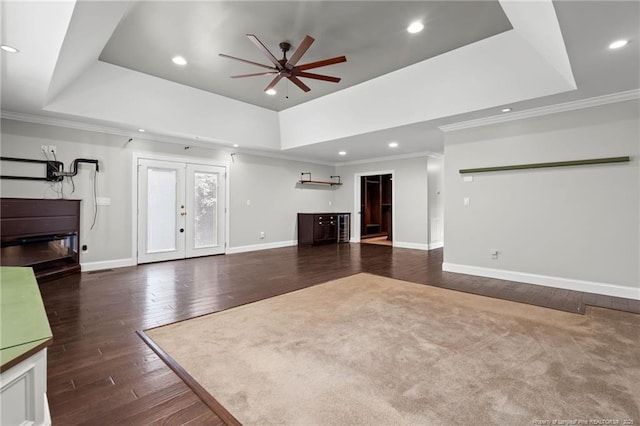 4304 Ferncreek Dr, Fayetteville, NC 28314 - unfurnished living room featuring a ceiling fan, a raised ceiling, french doors, hardwood / wood-style flooring, and ornamental molding