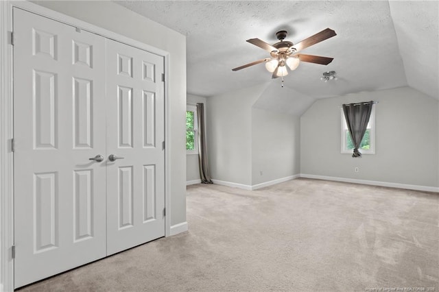 4304 Ferncreek Dr, Fayetteville, NC 28314 - bonus room featuring light carpet, ceiling fan, a textured ceiling, and vaulted ceiling