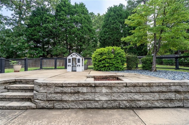 4304 Ferncreek Dr, Fayetteville, NC 28314 - exterior space with a shed and view of wooded area
