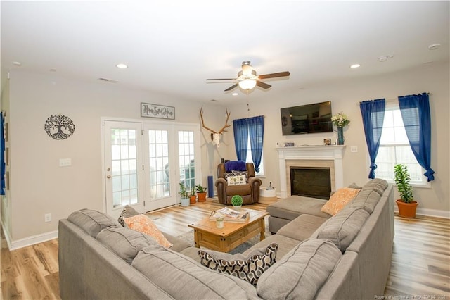 435 Lancaster Dr, Vass, NC 28394 - living room featuring a ceiling fan, light wood-style flooring, a fireplace, and recessed lighting