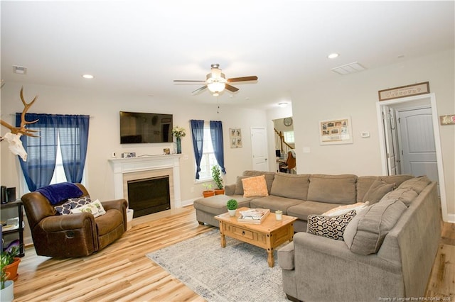 435 Lancaster Dr, Vass, NC 28394 - living room featuring a ceiling fan, light wood-style flooring, a fireplace, and recessed lighting