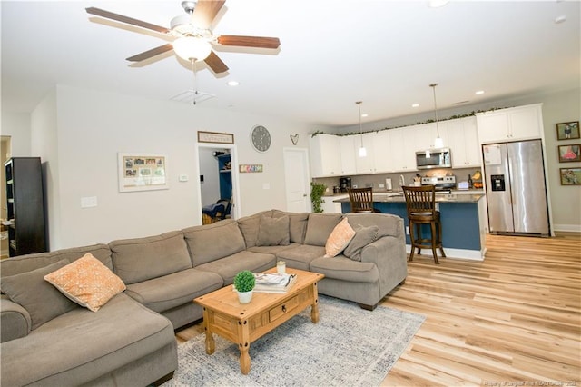 435 Lancaster Dr, Vass, NC 28394 - living room featuring light wood finished floors, a ceiling fan, and recessed lighting