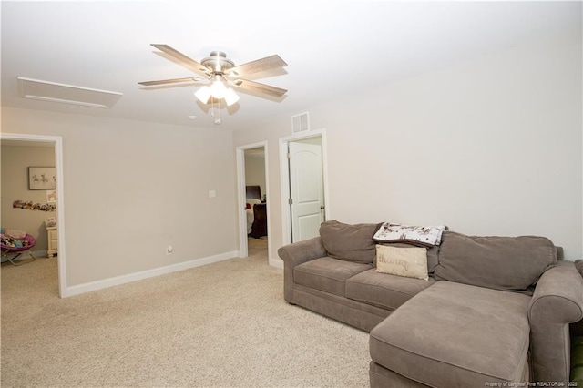 435 Lancaster Dr, Vass, NC 28394 - living room featuring light colored carpet, a ceiling fan, and attic access