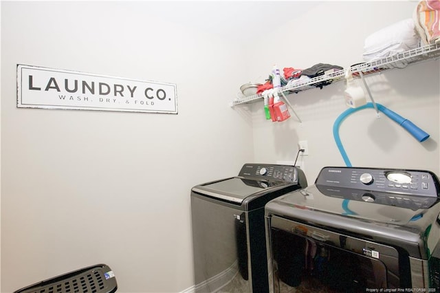 435 Lancaster Dr, Vass, NC 28394 - laundry room with washer and clothes dryer and baseboards