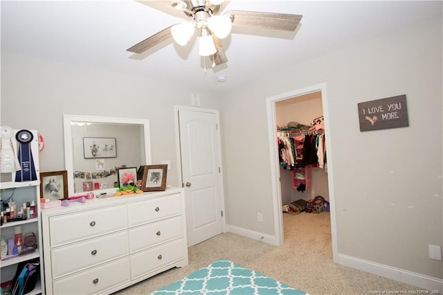 435 Lancaster Dr, Vass, NC 28394 - bedroom featuring a walk in closet, light colored carpet, a closet, and a ceiling fan