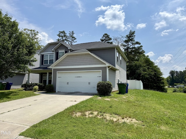 219 Trimble Dr, Elon, NC 27244 - view of front of home featuring a garage, concrete driveway, and a front yard