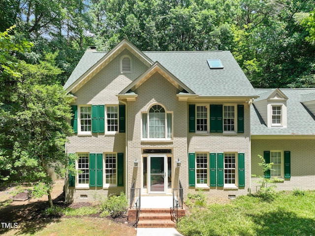 2401 Worthing Ct, Wake Forest, NC 27587 - colonial-style house featuring brick siding and roof with shingles