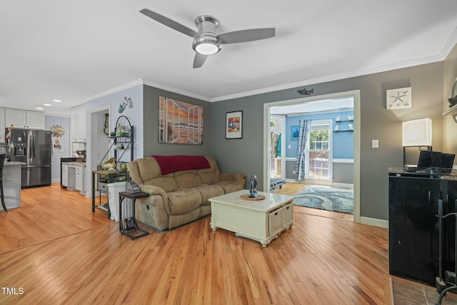 2401 Worthing Ct, Wake Forest, NC 27587 - living room with light wood finished floors, ceiling fan, ornamental molding, and recessed lighting