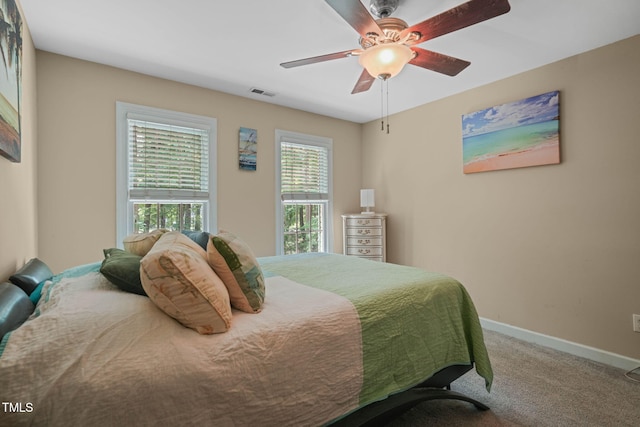 2401 Worthing Ct, Wake Forest, NC 27587 - carpeted bedroom featuring baseboards and a ceiling fan