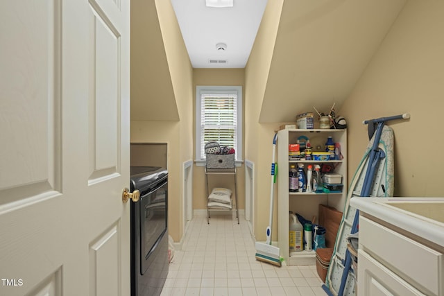 2401 Worthing Ct, Wake Forest, NC 27587 - washroom with washer and clothes dryer and light tile patterned floors