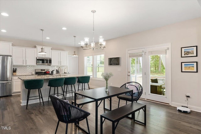 103 Foothill Ct, Sanford, NC 27330 - dining space featuring plenty of natural light, dark wood-style flooring, recessed lighting, and a chandelier