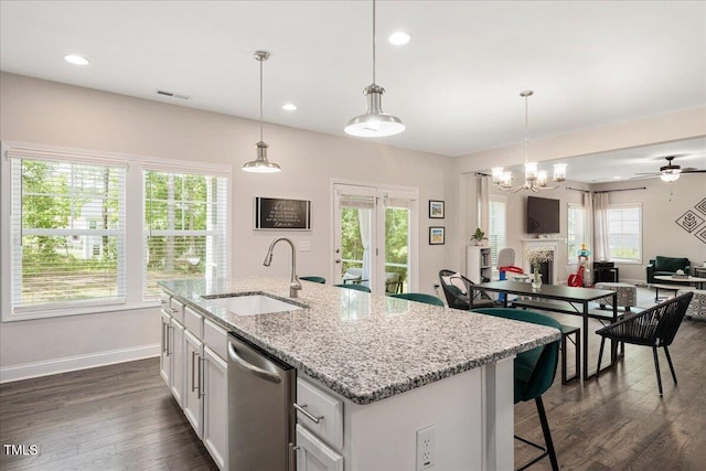 103 Foothill Ct, Sanford, NC 27330 - kitchen with dishwasher, open floor plan, dark wood-style floors, decorative light fixtures, and light stone countertops