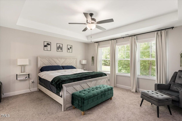 103 Foothill Ct, Sanford, NC 27330 - bedroom with a raised ceiling, light colored carpet, multiple windows, and ceiling fan