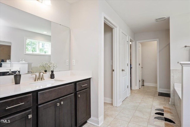 103 Foothill Ct, Sanford, NC 27330 - full bath featuring vanity, tiled bath, and tile patterned flooring