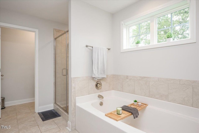 103 Foothill Ct, Sanford, NC 27330 - bathroom with a garden tub, a stall shower, and tile patterned floors