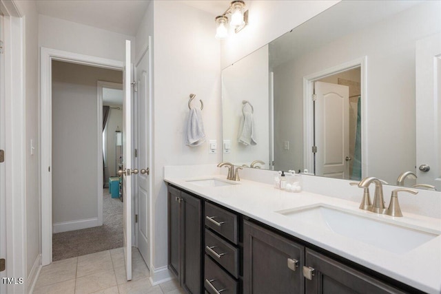 103 Foothill Ct, Sanford, NC 27330 - bathroom with double vanity and tile patterned floors