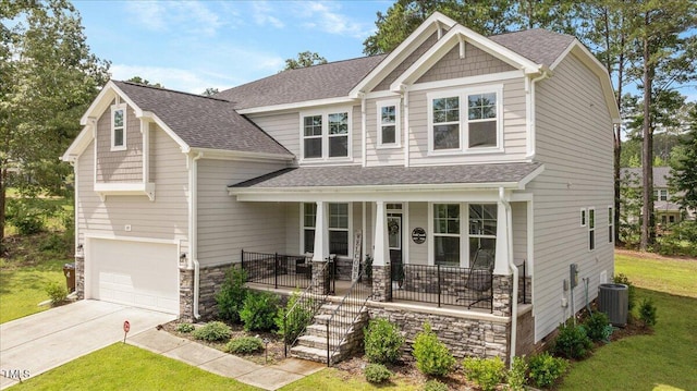 103 Foothill Ct, Sanford, NC 27330 - craftsman-style home with a porch, stone siding, a front lawn, concrete driveway, and roof with shingles