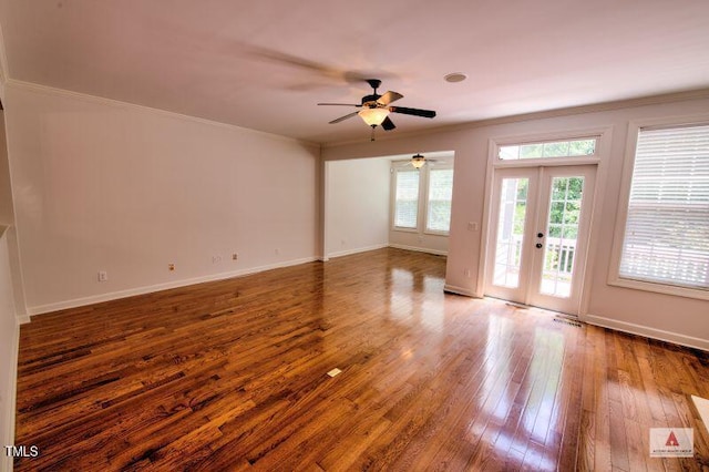 332 Bridgegate Dr, Cary, NC 27519 - unfurnished living room featuring ornamental molding, hardwood / wood-style flooring, a ceiling fan, and french doors