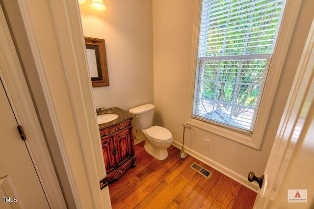 332 Bridgegate Dr, Cary, NC 27519 - half bathroom with vanity and wood finished floors