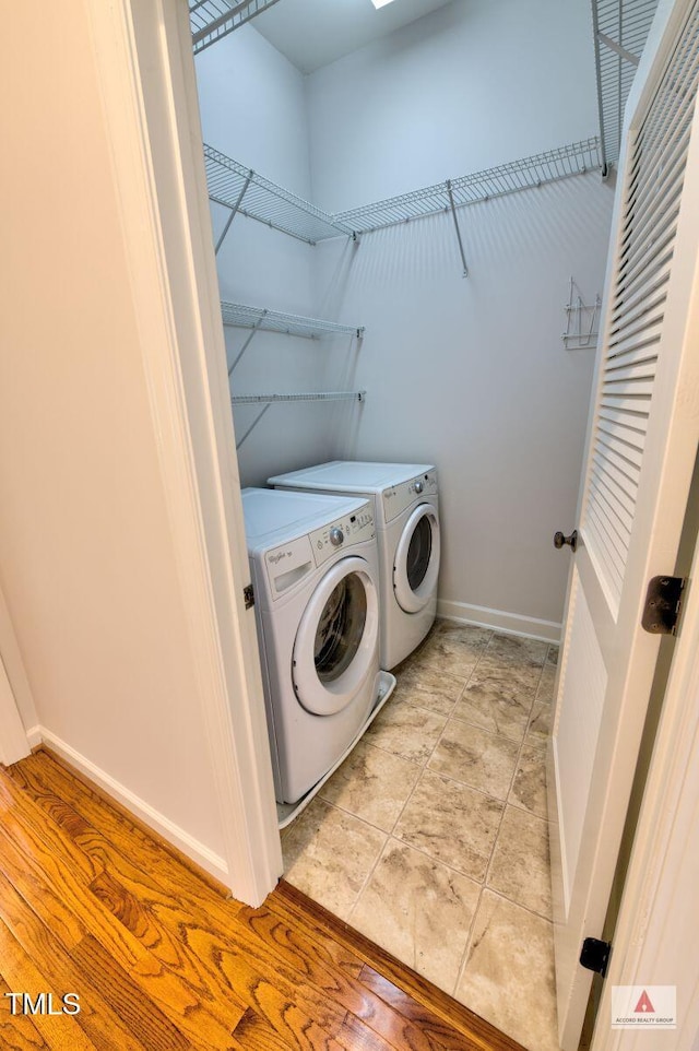 332 Bridgegate Dr, Cary, NC 27519 - washroom with washing machine and dryer and baseboards