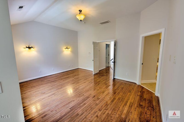 332 Bridgegate Dr, Cary, NC 27519 - empty room with vaulted ceiling and wood finished floors
