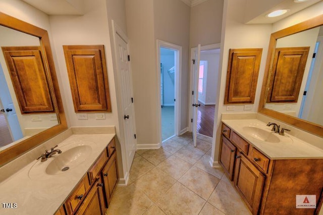 332 Bridgegate Dr, Cary, NC 27519 - bathroom with two vanities and tile patterned floors